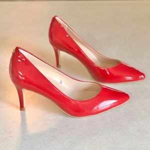 Kate Spade red patent leather pumps
